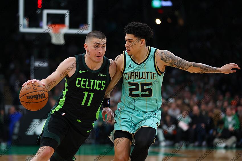 Apr 13, 2025; Boston, Massachusetts, USA; Boston Celtics guard Payton Pritchard (11) drives to the basket during the first half defended by Charlotte Hornets guard KJ Simpson (25) at TD Garden. Mandatory Credit: Paul Rutherford-Imagn Images NBA: Charlotte Hornets at Boston Celtics 