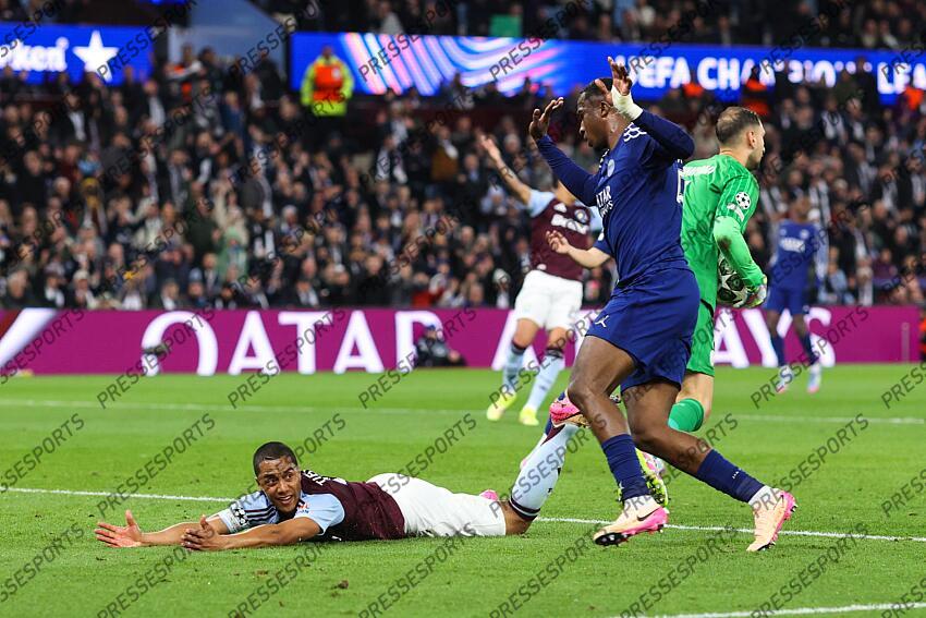 15 April 2025, Aston - Champions League Football, Quarter-Final, Second Leg - Aston Villa v Paris Saint-Germain - Willian Pacho of PSG trips Youri Tielemans of Aston Villa - Photo: Charlotte Wilson / Offside. ASTON VILLA-PSG (3-2) 