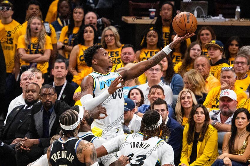 Apr 29, 2025; Indianapolis, Indiana, USA; Indiana Pacers guard Bennedict Mathurin (00) shoots the ball while Milwaukee Bucks forward Bobby Portis (9) defends during game five of the first round for the 2024 NBA Playoffs at Gainbridge Fieldhouse. Mandatory Credit: Trevor Ruszkowski-Imagn Images NBA: Playoffs-Milwaukee Bucks at Indiana Pacers 