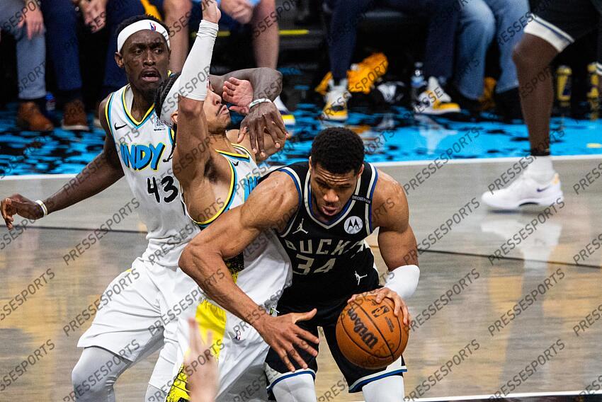 Apr 29, 2025; Indianapolis, Indiana, USA; Milwaukee Bucks forward Giannis Antetokounmpo (34) dribbles the ball while Indiana Pacers guard Andrew Nembhard (2) defends during game five of the first round for the 2024 NBA Playoffs at Gainbridge Fieldhouse. Mandatory Credit: Trevor Ruszkowski-Imagn Images NBA: Playoffs-Milwaukee Bucks at Indiana Pacers 