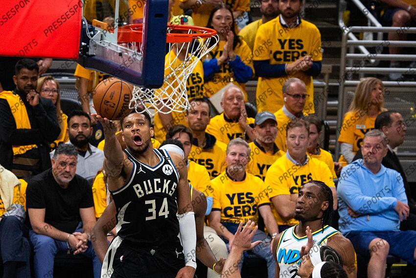 Apr 29, 2025; Indianapolis, Indiana, USA; Milwaukee Bucks forward Giannis Antetokounmpo (34) shoots the ball while Indiana Pacers guard Andrew Nembhard (2) defends during game five of the first round for the 2024 NBA Playoffs at Gainbridge Fieldhouse. Mandatory Credit: Trevor Ruszkowski-Imagn Images NBA: Playoffs-Milwaukee Bucks at Indiana Pacers 