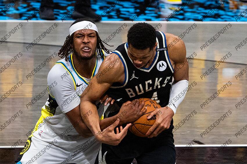 Apr 29, 2025; Indianapolis, Indiana, USA; Indiana Pacers center Myles Turner (33) and Milwaukee Bucks forward Giannis Antetokounmpo (34) fight for the ball during game five of the first round for the 2024 NBA Playoffs at Gainbridge Fieldhouse. Mandatory Credit: Trevor Ruszkowski-Imagn Images NBA: Playoffs-Milwaukee Bucks at Indiana Pacers 