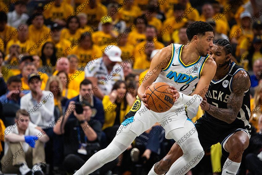 Apr 29, 2025; Indianapolis, Indiana, USA; Indiana Pacers guard Tyrese Haliburton (0) dribbles the ball while Milwaukee Bucks guard Kevin Porter Jr. (3) defends during game five of the first round for the 2024 NBA Playoffs at Gainbridge Fieldhouse. Mandatory Credit: Trevor Ruszkowski-Imagn Images NBA: Playoffs-Milwaukee Bucks at Indiana Pacers 