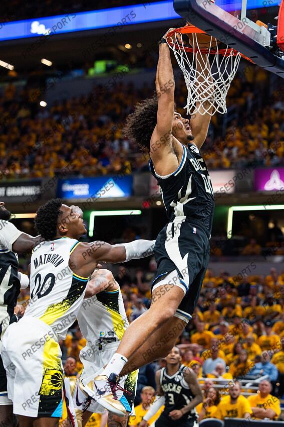Apr 29, 2025; Indianapolis, Indiana, USA; Milwaukee Bucks center Jericho Sims (00) shoots the ball while Indiana Pacers guard Bennedict Mathurin (00) defends during game five of the first round for the 2024 NBA Playoffs at Gainbridge Fieldhouse. Mandatory Credit: Trevor Ruszkowski-Imagn Images NBA: Playoffs-Milwaukee Bucks at Indiana Pacers 