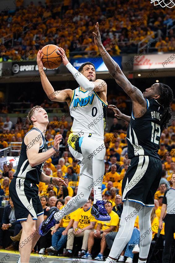 Apr 29, 2025; Indianapolis, Indiana, USA; Indiana Pacers guard Tyrese Haliburton (0) shoots the ball while Milwaukee Bucks forward Taurean Prince (12) defends during game five of the first round for the 2024 NBA Playoffs at Gainbridge Fieldhouse. Mandatory Credit: Trevor Ruszkowski-Imagn Images NBA: Playoffs-Milwaukee Bucks at Indiana Pacers 
