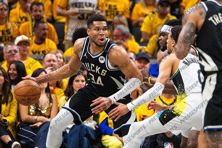 Apr 29, 2025; Indianapolis, Indiana, USA; Milwaukee Bucks forward Giannis Antetokounmpo (34) dribbles the ball while Indiana Pacers forward Jarace Walker (5) defends during game five of the first round for the 2024 NBA Playoffs at Gainbridge Fieldhouse. Mandatory Credit: Trevor Ruszkowski-Imagn Images NBA: Playoffs-Milwaukee Bucks at Indiana Pacers 