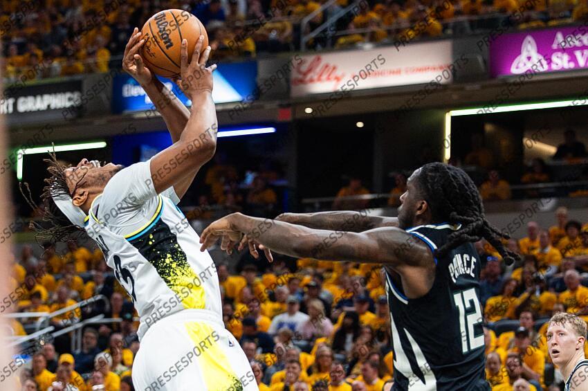 Apr 29, 2025; Indianapolis, Indiana, USA; Indiana Pacers center Myles Turner (33) shoots the ball while Milwaukee Bucks forward Taurean Prince (12) defends during game five of the first round for the 2024 NBA Playoffs at Gainbridge Fieldhouse. Mandatory Credit: Trevor Ruszkowski-Imagn Images NBA: Playoffs-Milwaukee Bucks at Indiana Pacers 