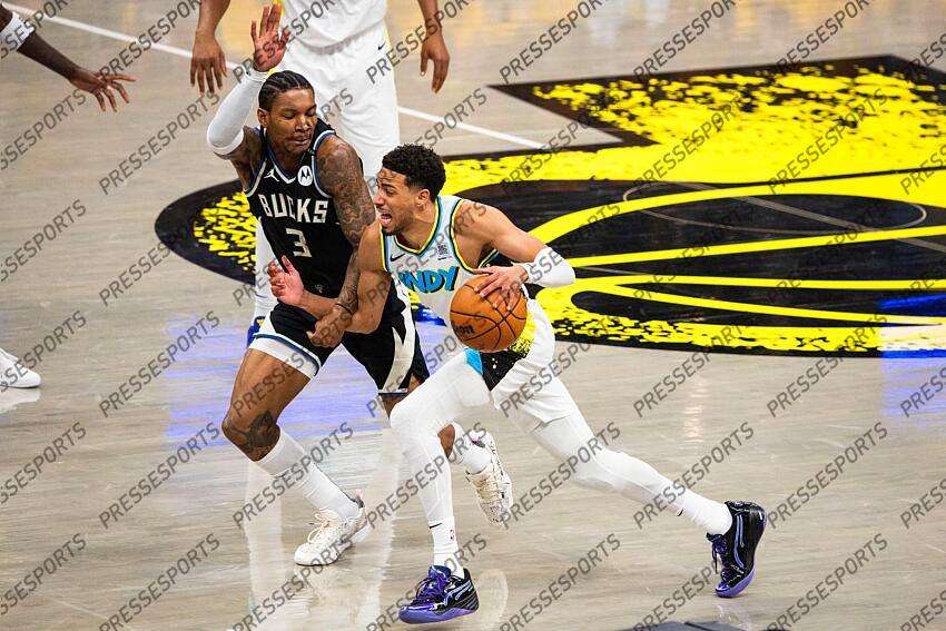 Apr 29, 2025; Indianapolis, Indiana, USA; Indiana Pacers guard Tyrese Haliburton (0) dribbles the ball while Milwaukee Bucks guard Kevin Porter Jr. (3) defends during game five of the first round for the 2024 NBA Playoffs at Gainbridge Fieldhouse. Mandatory Credit: Trevor Ruszkowski-Imagn Images NBA: Playoffs-Milwaukee Bucks at Indiana Pacers 