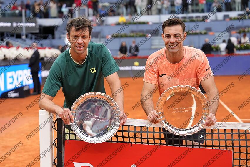Horacio Zeballos of Argentina and Marcel Granollers of Spain pose with the winners trophies after winning against Marcelo Arevalo of El Salvador and Mate Pavic of Croatia during the Men Double’s Final of Mutua Madrid Open 2025 - ATP Masters 1000 celebrated at Caja Magica on May 03, 2025 in Madrid, Spain. FINALE MUTUA MADRID OPEN 