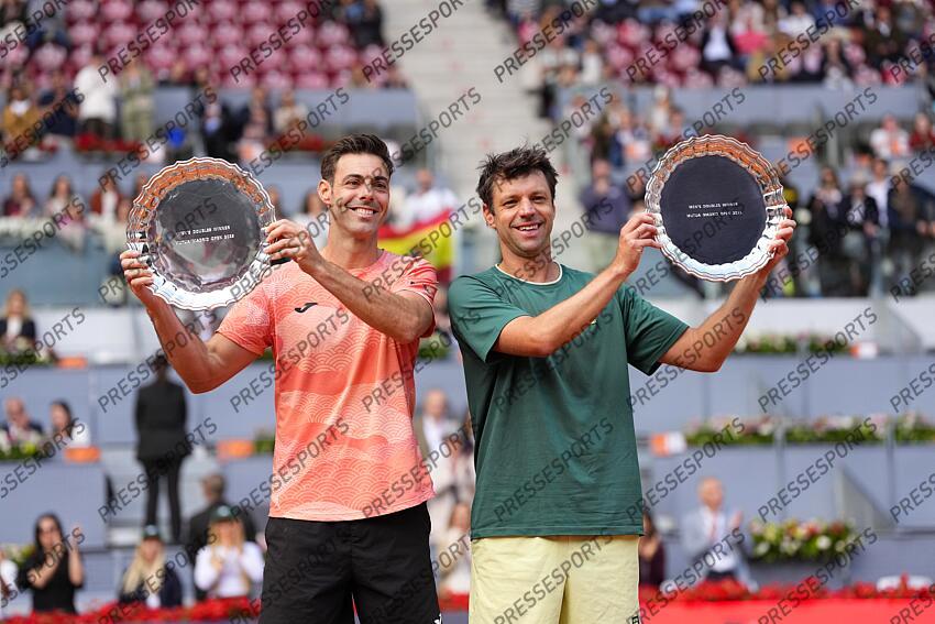 Horacio Zeballos of Argentina and Marcel Granollers of Spain pose for a photo with their Men's Doubles Final winners trophies following their victory against Marcelo Arevalo of Salvador and Mate Pavic of Croatia of Mutua Madrid Open 2025 - Masters 1000 tennis tournament celebrated at Caja Magica on May 03, 2025 in Madrid, Spain. FINALE MUTUA MADRID OPEN 