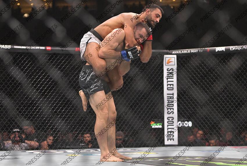 May 10, 2025; Montreal, Quebec, CANADA; Benoit Saint Denis (red gloves) fights Kyle Prepolec (blue gloves) during UFC 315 at Bell Centre. Mandatory Credit: Eric Bolte-Imagn Images SAINT DENIS/PREPOLEC 