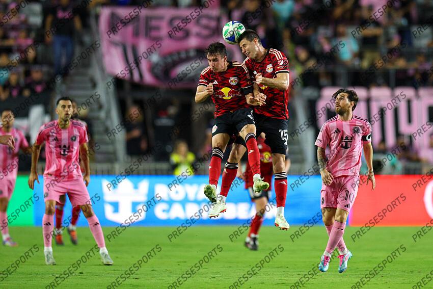 May 3, 2025; Fort Lauderdale, Florida, USA; New York Red Bulls defender Sean Nealis (15) heads the ball with midfielder Peter Stroud (8) against Inter Miami CF in the first half at Chase Stadium. Mandatory Credit: Nathan Ray Seebeck-Imagn Images MLS: New York Red Bulls at Inter Miami CF 