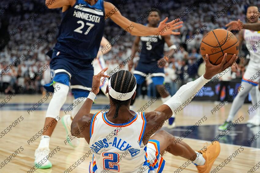 May 26, 2025; Minneapolis, Minnesota, USA; Oklahoma City Thunder guard Shai Gilgeous-Alexander (2) gets a rebound against the Minnesota Timberwolves during game four of the western conference finals for the 2025 NBA Playoffs at Target Center. Mandatory Credit: Jesse Johnson-Imagn Images NBA: Playoffs-Oklahoma City Thunder at Minnesota Timberwolves 