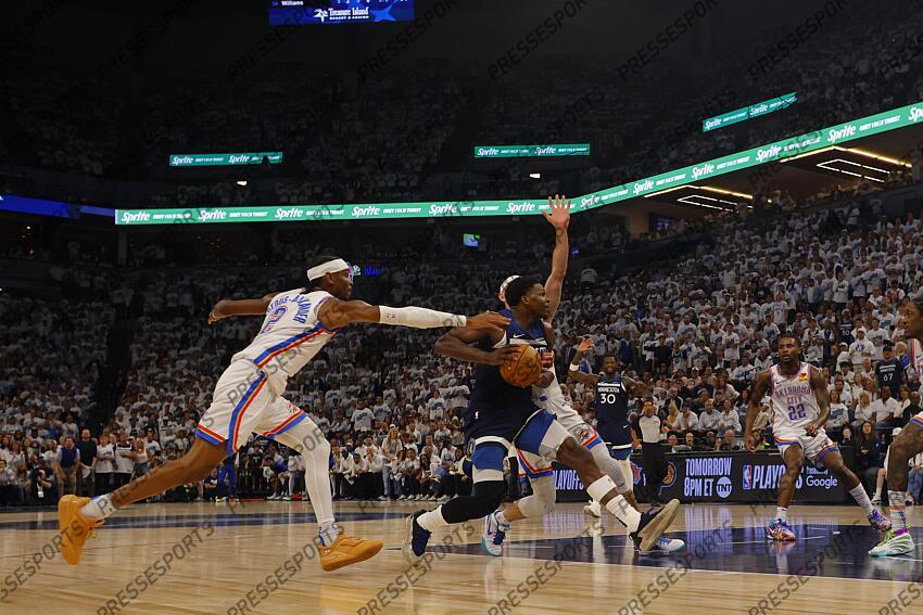 May 26, 2025; Minneapolis, Minnesota, USA; Minnesota Timberwolves guard Anthony Edwards (5) dribbles the ball past Oklahoma City Thunder guard Shai Gilgeous-Alexander (2) in the second half during game four of the western conference finals for the 2025 NBA Playoffs at Target Center. Mandatory Credit: Bruce Kluckhohn-Imagn Images NBA: Playoffs-Oklahoma City Thunder at Minnesota Timberwolves 