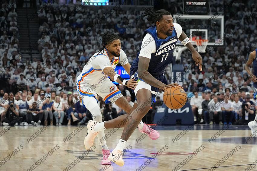 May 26, 2025; Minneapolis, Minnesota, USA; Minnesota Timberwolves center Naz Reid (11) dribbles the ball against the Oklahoma City Thunder in the second half during game four of the western conference finals for the 2025 NBA Playoffs at Target Center. Mandatory Credit: Bruce Kluckhohn-Imagn Images NBA: Playoffs-Oklahoma City Thunder at Minnesota Timberwolves 