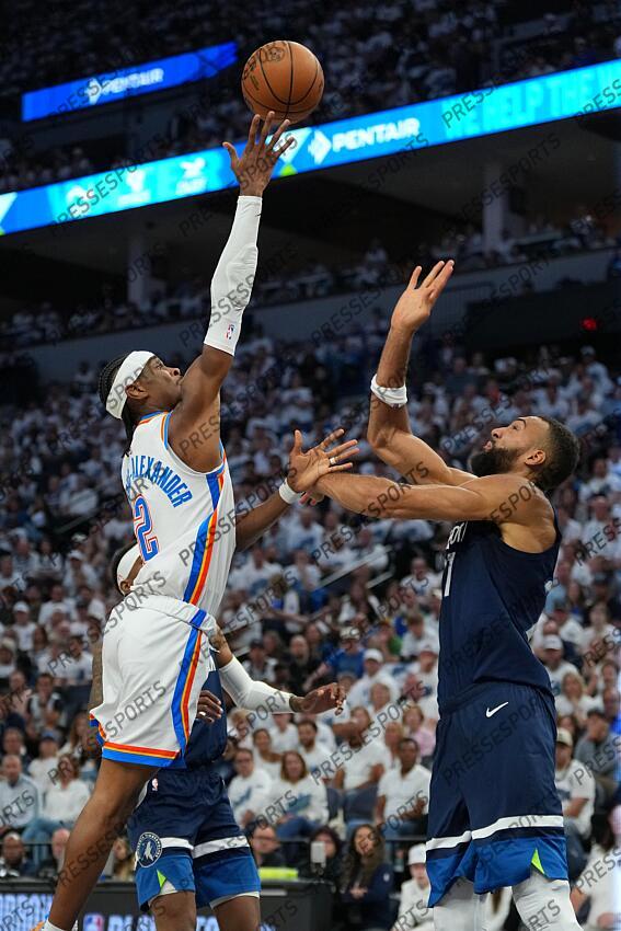 May 26, 2025; Minneapolis, Minnesota, USA; Oklahoma City Thunder guard Shai Gilgeous-Alexander (2) shoots the ball over Minnesota Timberwolves center Rudy Gobert (27) in the first half during game four of the western conference finals for the 2025 NBA Playoffs at Target Center. Mandatory Credit: Jesse Johnson-Imagn Images NBA: Playoffs-Oklahoma City Thunder at Minnesota Timberwolves 