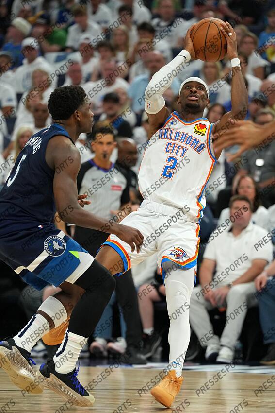 May 26, 2025; Minneapolis, Minnesota, USA; Oklahoma City Thunder guard Shai Gilgeous-Alexander (2) shoots the ball past Minnesota Timberwolves guard Anthony Edwards (5) in the first half during game four of the western conference finals for the 2025 NBA Playoffs at Target Center. Mandatory Credit: Jesse Johnson-Imagn Images NBA: Playoffs-Oklahoma City Thunder at Minnesota Timberwolves 