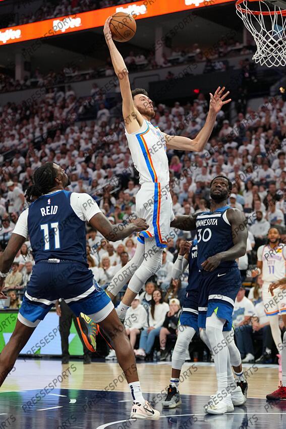 May 26, 2025; Minneapolis, Minnesota, USA; Oklahoma City Thunder forward Chet Holmgren (7) shoots the ball over Minnesota Timberwolves center Naz Reid (11) in the first half during game four of the western conference finals for the 2025 NBA Playoffs at Target Center. Mandatory Credit: Jesse Johnson-Imagn Images NBA: Playoffs-Oklahoma City Thunder at Minnesota Timberwolves 