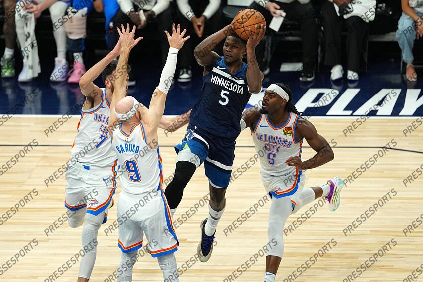May 26, 2025; Minneapolis, Minnesota, USA; Minnesota Timberwolves guard Anthony Edwards (5) attempts to make a pass against Oklahoma City Thunder guard Alex Caruso (9), guard Luguentz Dort (5) and forward Chet Holmgren (7) in the first half during game four of the western conference finals for the 2025 NBA Playoffs at Target Center. Mandatory Credit: Jesse Johnson-Imagn Images NBA: Playoffs-Oklahoma City Thunder at Minnesota Timberwolves 