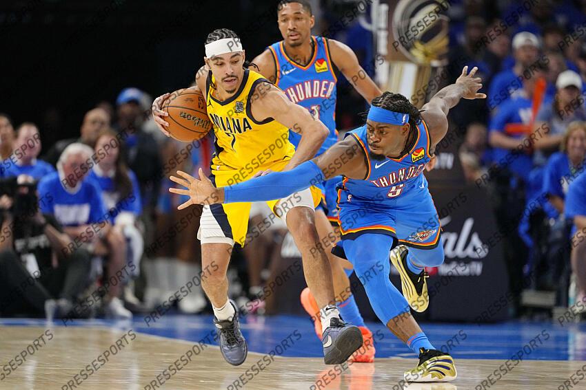Jun 8, 2025; Oklahoma City, Oklahoma, USA; Oklahoma City Thunder guard Luguentz Dort (5) reaches for the ball against Indiana Pacers guard Andrew Nembhard (2) during the second half during game two of the 2025 NBA Finals at Paycom Center. Mandatory Credit: Kyle Terada-Imagn Images Game 2 Indiana Pacers at Oklahoma City Thunder 