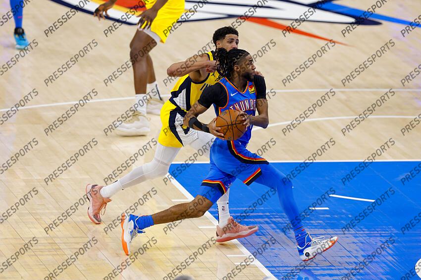 Jun 8, 2025; Oklahoma City, Oklahoma, USA; Oklahoma City Thunder guard Isaiah Joe (11) drives to the basket past Indiana Pacers guard Tyrese Haliburton (0) during the second quarter of game two of the 2025 NBA Finals at Paycom Center. Mandatory Credit: Alonzo Adams-Imagn Images Game 2 Indiana Pacers at Oklahoma City Thunder 