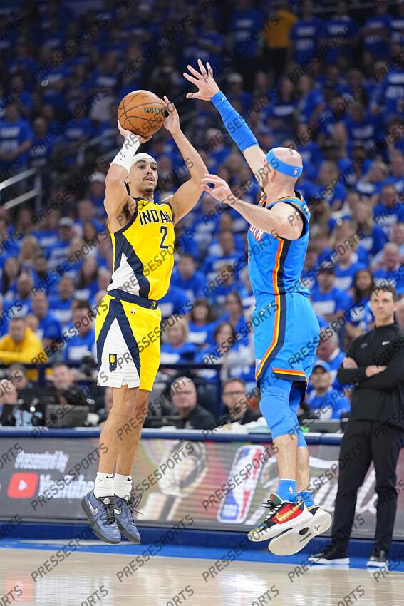Jun 8, 2025; Oklahoma City, Oklahoma, USA; Indiana Pacers guard Andrew Nembhard (2) shoots the ball against Oklahoma City Thunder guard Alex Caruso (9) during the first half during game two of the 2025 NBA Finals at Paycom Center. Mandatory Credit: Kyle Terada-Imagn Images Game 2 Indiana Pacers at Oklahoma City Thunder 