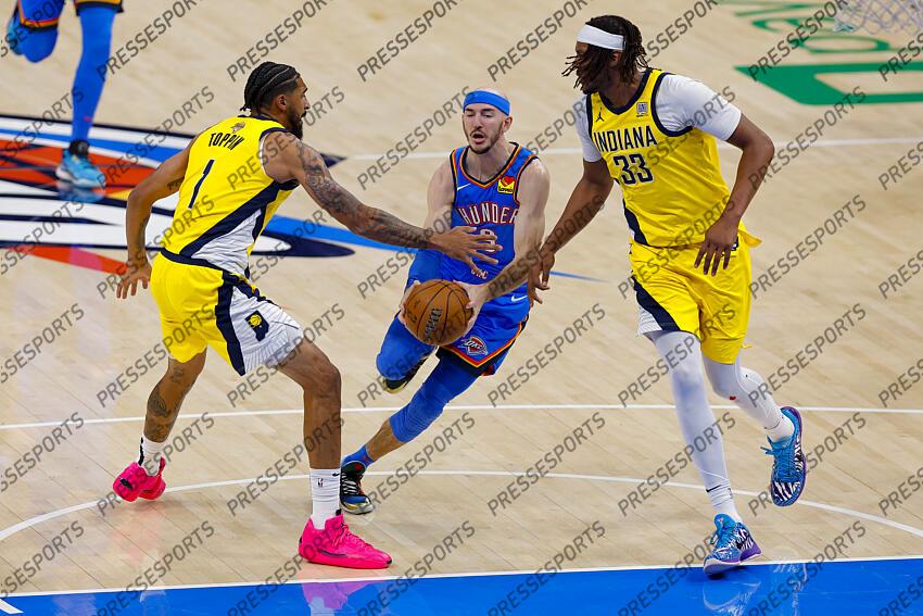 Jun 8, 2025; Oklahoma City, Oklahoma, USA; Oklahoma City Thunder guard Alex Caruso (9) drives to the basket between Indiana Pacers forward Obi Toppin (1) and center Myles Turner (33) during the first quarter of game two of the 2025 NBA Finals at Paycom Center. Mandatory Credit: Alonzo Adams-Imagn Images Game 2 Indiana Pacers at Oklahoma City Thunder 